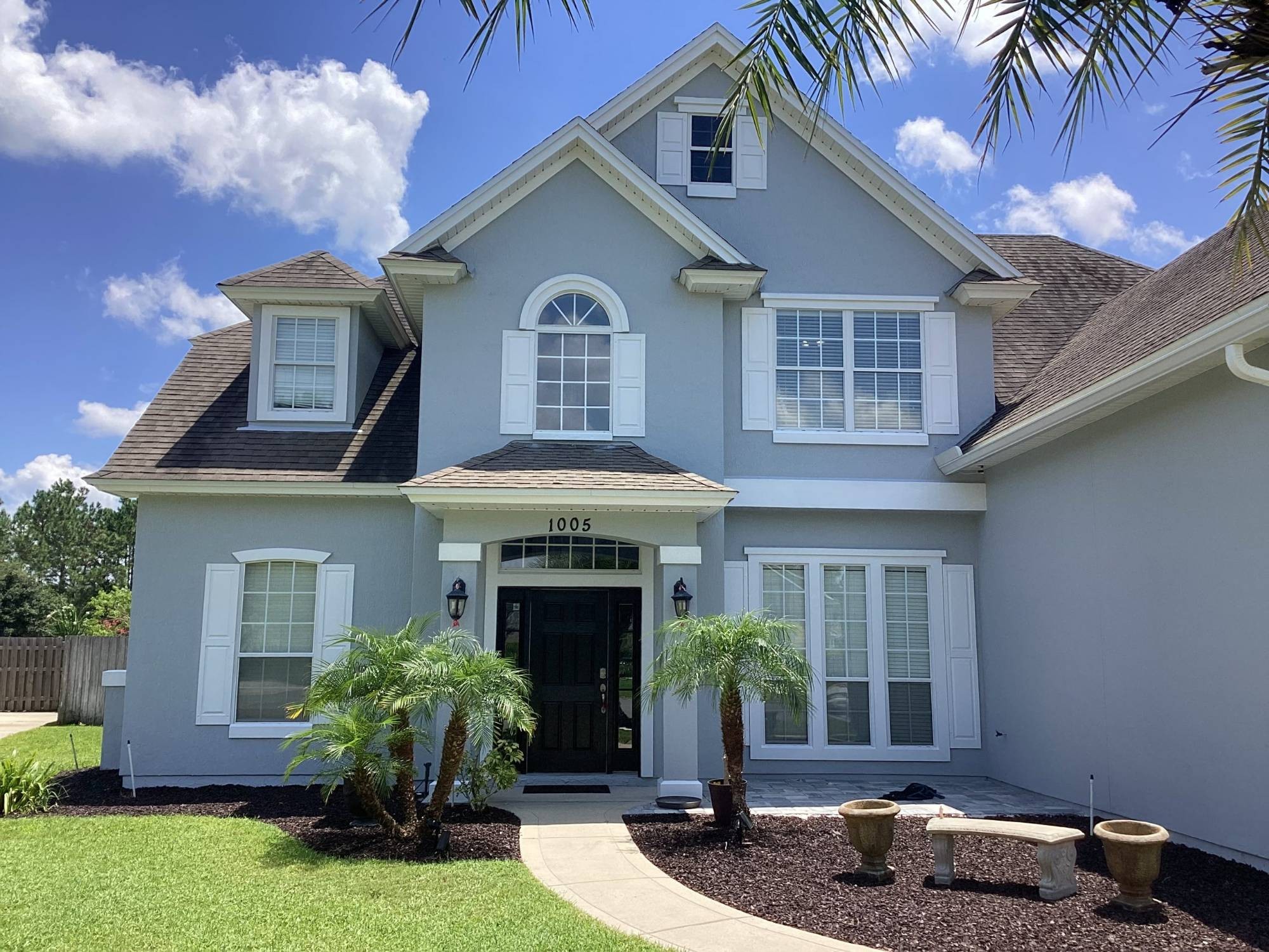 Freshly painted gray two-story home